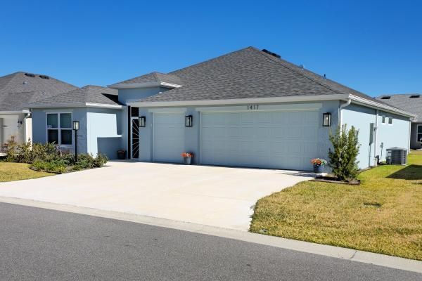 Clean residential concrete driveway at a Central Florida home in a suburban neighborhood