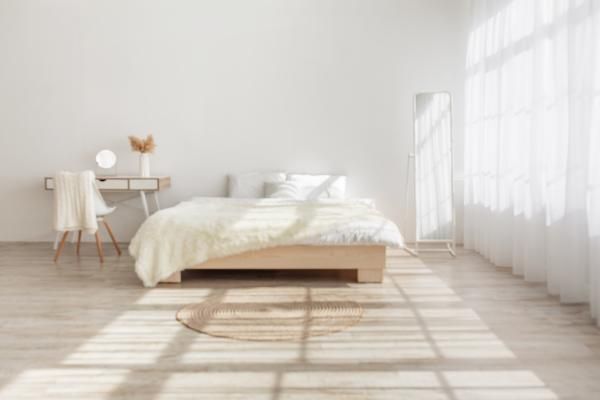 Bright bedroom with strong sunlight coming through large windows in a Central Florida home